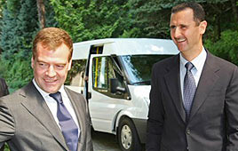 Dmitry Medvedev (L) and Bashar Assad (Photo: AFP)