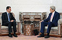 US Senator John Kerry with Syrian President Bashar Assad (Photo: AFP)