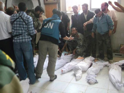 גופות הילדים שנטבחו בסוריה. "הוצאו להורג"  (צילום: רויטרס)
