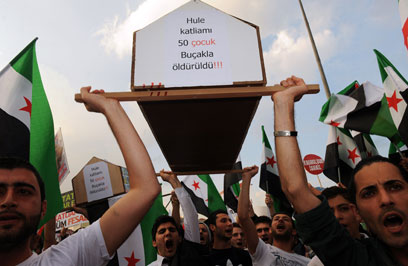 ארון המתים לזכר ההרוגים בסוריה (צילום: AFP)