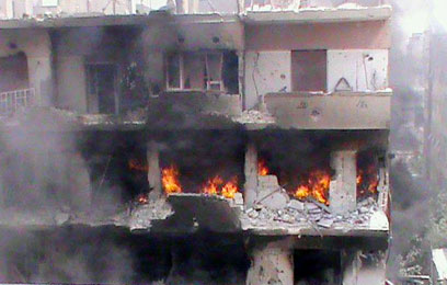 אל-חאלדיה, מבט מקרוב. תחת אש (צילום: AFP/HO/ SHAAM NEWS NETWORK)