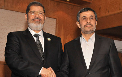 פגישת מורסי ואחמדינג'אד בטהרן לאחר הפסגה במכה (צילום: רויטרס)