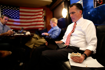 Romney on campaign bus (Photo: AP)