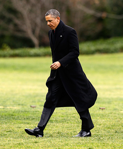 אובמה עם שובו השבוע לבית הלבן (צילום:AP)