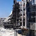Homs after shelling Photo: Reuters