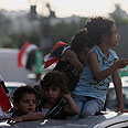 Gazans celebrate Islamist victory is Egypt Photo: AFP